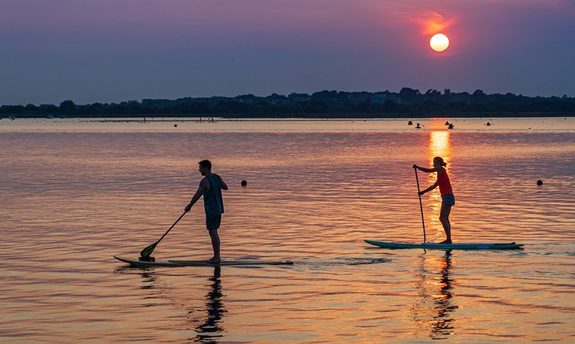 paddle boarding at night featured